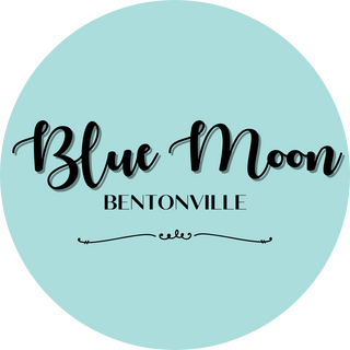 Round logo with 'Blue Moon Bentonville' text on a light blue background