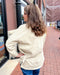 back of ecru faux leather jacket