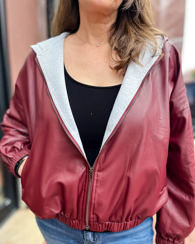close-up of wine faux leather hoodie jacket