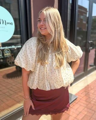 Ecru polka dot puff sleeve top by Entro, shown front, back, and detail views on model