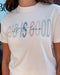 White t-shirt with colorful text 'God is good all the time' worn by a person.