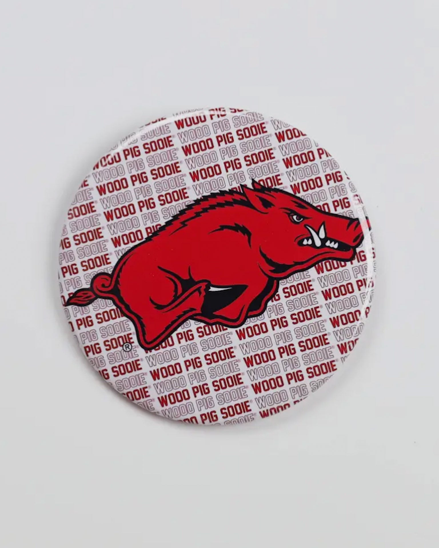 Button badge with red pig logo and 'Woo Pig Sooie' text on a white background