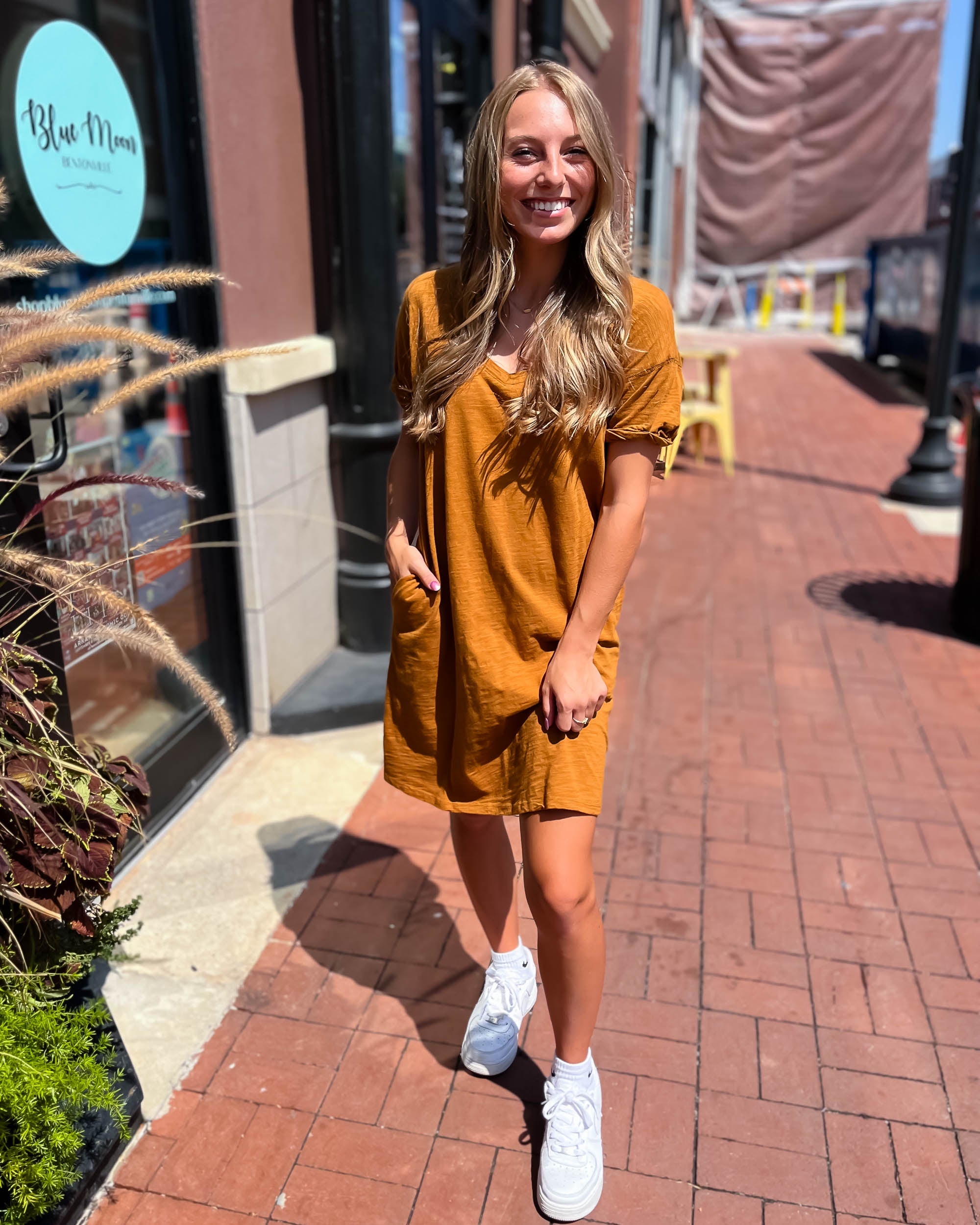 girl in dark mustard t-shirt dress