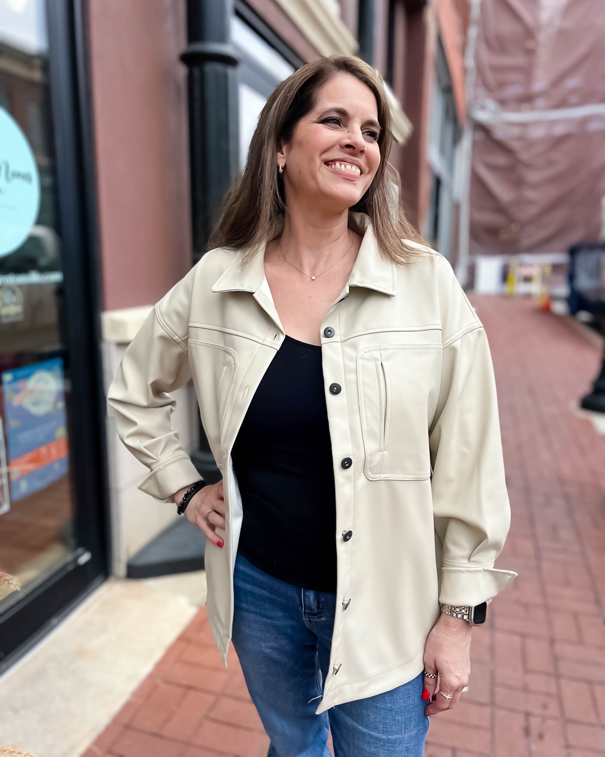 woman in ecru faux leather jacket