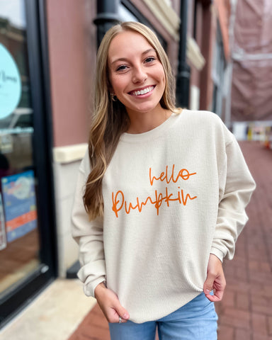 girl wearing corded Hello Pumpkin sweatshirt